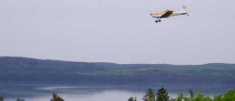 An airplane that sprays mercury into the experimental lake area